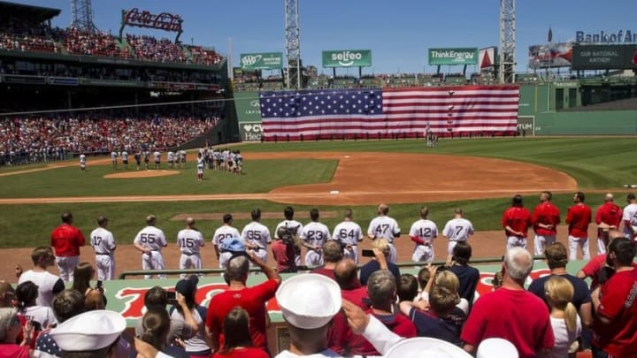 Jul 4, 2016; Boston, MA, USA; Sailors salute the flag during the National Anthem before the game between the Boston Red Sox and the Texas Rangers at Fenway Park. Mandatory Credit: Winslow Townson-USA TODAY Sports