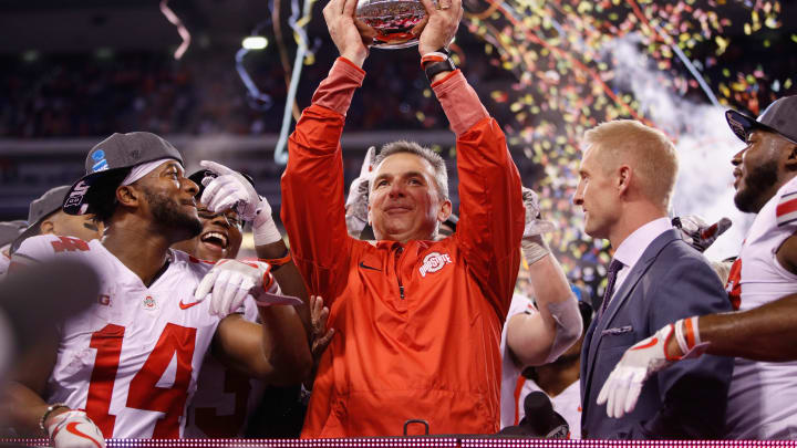 INDIANAPOLIS, IN – DECEMBER 02: Head coach Urban Meyer of the Ohio State Buckeyes celebrates with the trophy after their 27-21 win over the Wisconsin Badgers during the Big Ten Championship game at Lucas Oil Stadium on December 2, 2017 in Indianapolis, Indiana. (Photo by Joe Robbins/Getty Images)