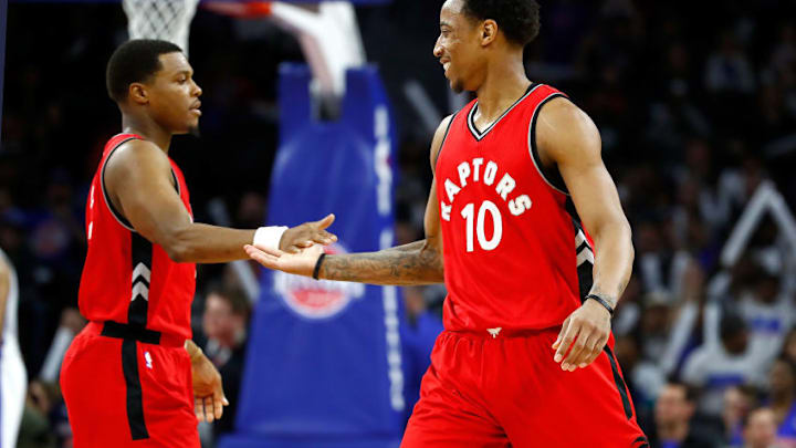 AUBURN HILLS, MI - APRIL 05: DeMar DeRozan #10 of the Toronto Raptors reacts with Kyle Lowry #7 after hitting a late fourth quarter jump shot while playing the Detroit Pistons at the Palace of Auburn Hills on April 5, 2017 in Auburn Hills, Michigan. Toronto won the game 105-102. NOTE TO USER: User expressly acknowledges and agrees that, by downloading and or using this photograph, User is consenting to the terms and conditions of the Getty Images License Agreement. (Photo by Gregory Shamus/Getty Images)
