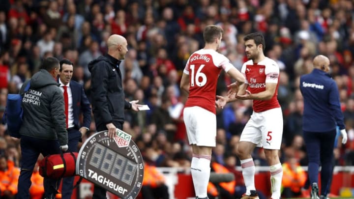 LONDON, ENGLAND - SEPTEMBER 23: Sokratis Papastathopoulos of Arsenal is substituted for Rob Holding of Arsenal during the Premier League match between Arsenal FC and Everton FC at Emirates Stadium on September 23, 2018 in London, United Kingdom. (Photo by Julian Finney/Getty Images)