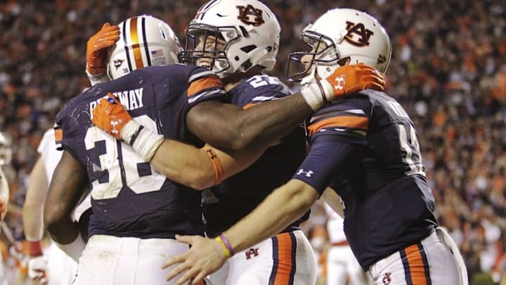 Oct 22, 2016; Auburn, AL, USA; Auburn Tigers running back Kamryn Pittway (36) celebrates a touchdown with fullback Chandler Cox (27) and quarterback Sean White (13) during the third quarter against the Arkansas Razorbacks at Jordan Hare Stadium. The Tigers beat the Razorbacks 56-3. Mandatory Credit: John Reed-USA TODAY Sports