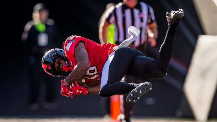 LUBBOCK, TEXAS – NOVEMBER 13: Receiver Myles Price #18 of the Texas Tech Red Raiders falls into the end zone for a touchdown during the first half of the college football game against the Iowa State Cyclones at Jones AT&T Stadium on November 13, 2021 in Lubbock, Texas. (Photo by John E. Moore III/Getty Images)