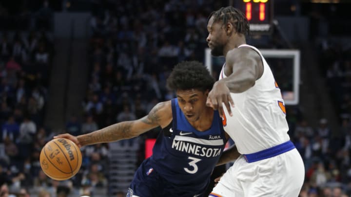 Minnesota Timberwolves forward Jaden McDaniels works around New York Knicks forward Julius Randle. Mandatory Credit: Bruce Kluckhohn-USA TODAY Sports