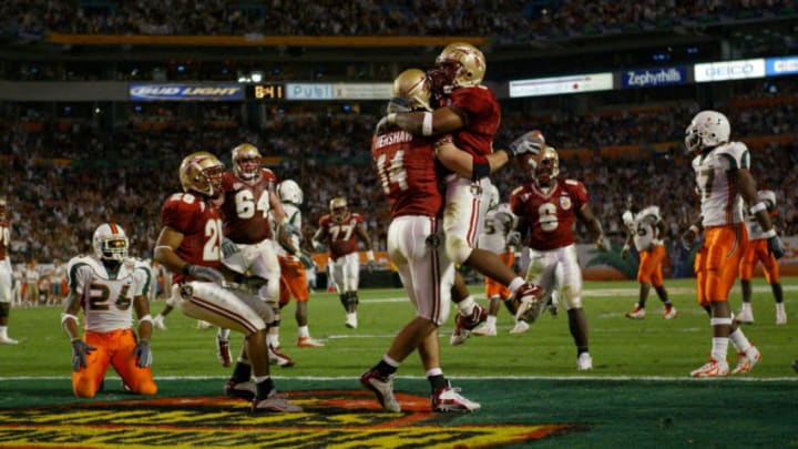 MIAMI - JANUARY 1: Quarterback Chris Rix #16 and Matt Meinrod #64 of the Florida State Seminoles celebrate in the end zone during the 2004 Orange Bowl game against the Miami Hurricanes on January 1, 2004 at Pro Player Stadium in Miami, Florida. Miami defeated Forida State 16-14. (Photo by Jamie Squire/Getty Images)
