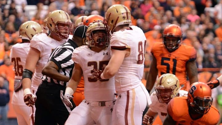 Nov 28, 2015; Syracuse, NY, USA; Boston College Eagles running back Tyler Rouse (35) is congratulated by teammates after scoring a rushing touchdown during the first quarter of a game against the Syracuse Orange at the Carrier Dome. Mandatory Credit: Mark Konezny-USA TODAY Sports