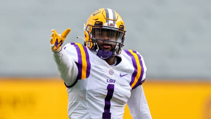 Apr 17, 2021; Baton Rouge, Louisiana, USA; LSU Tigers wide receiver Kayshon Boutte (1) reacts to making a catch against LSU Tigers cornerback Derek Stingley Jr. (24) during the first half of the annual Purple and White spring game at Tiger Stadium. Mandatory Credit: Stephen Lew-USA TODAY Sports