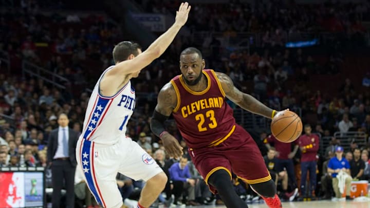 PHILADELPHIA, PA - NOVEMBER 27: LeBron James #23 of the Cleveland Cavaliers drives to the basket against T.J. McConnell #1 of the Philadelphia 76ers in the fourth quarter at Wells Fargo Center on November 27, 2016 in Philadelphia, Pennsylvania. The Cavaliers defeated the 76ers 112-108. NOTE TO USER: User expressly acknowledges and agrees that, by downloading and or using this photograph, User is consenting to the terms and conditions of the Getty Images License Agreement. (Photo by Mitchell Leff/Getty Images)