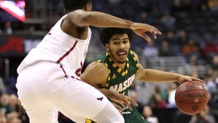 WASHINGTON, DC - MARCH 09: Otis Livingston II #4 of the George Mason Patriots dribbles against the Saint Joseph's Hawks during the first half in the Quarterfinals of the Atlantic 10 Basketball Tournament at Capital One Arena on March 9, 2018 in Washington, DC.(Photo by Patrick Smith/Getty Images)