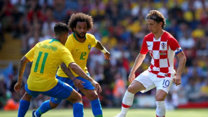 LIVERPOOL, ENGLAND – JUNE 03: Luke Modric of Croatia is challenged by Marcelo of Brazil and Philippe Coutinho of Brazil during the International Friendly match between Croatia and Brazil at Anfield on June 3, 2018 in Liverpool, England. (Photo by Alex Livesey/Getty Images)