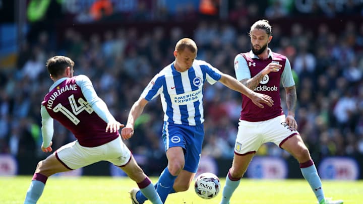 BIRMINGHAM, ENGLAND - MAY 07: Steve Sidwell of Brighton and Hove Albion competes for the ball with Conor Hourihane(L) and Henri Lansbury of Aston Villa the Sky Bet Championship match between Aston Villa and Brighton