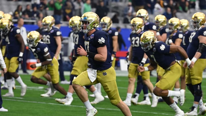 GLENDALE, ARIZONA – JANUARY 01: Jack Coan #17 of the Notre Dame Fighting Irish prepares for a game against the Oklahoma State University Cowboys prior to the Play Station Fiesta Bowl at State Farm Stadium on January 01, 2022 in Glendale, Arizona. (Photo by Norm Hall/Getty Images)