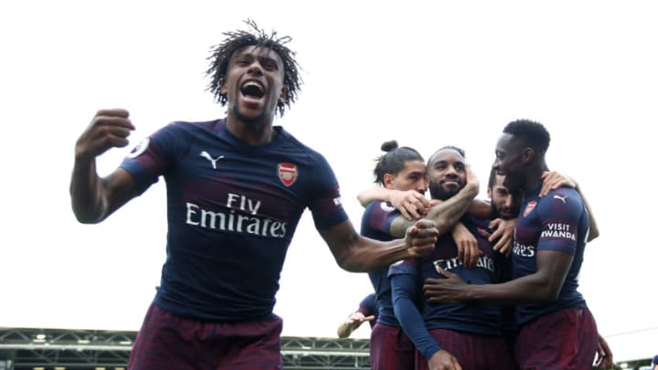 Arsenal's Alex Iwobi celebrates to the fans after Alexandre Lacazette (back) scores his side's second goal of the game during the Premier League match at Craven Cottage, London. (Photo by John Walton/PA Images via Getty Images)