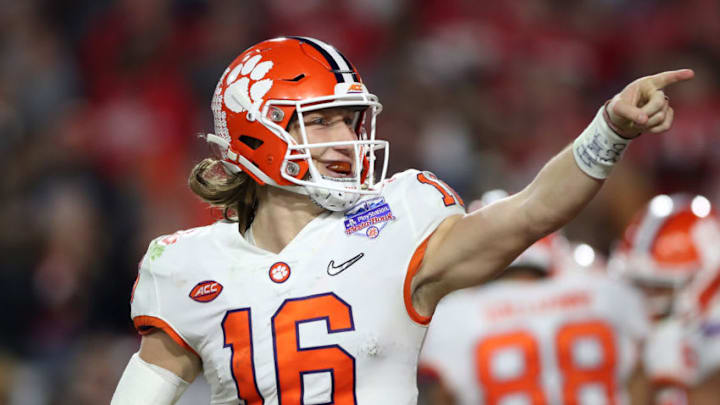 GLENDALE, ARIZONA - DECEMBER 28: Trevor Lawrence #16 of the Clemson Tigers celebrates his 34-yard touchdown pass to Travis Etienne (not pictured) against the Ohio State Buckeyes in the second half during the College Football Playoff Semifinal at the PlayStation Fiesta Bowl at State Farm Stadium on December 28, 2019 in Glendale, Arizona. (Photo by Matthew Stockman/Getty Images)