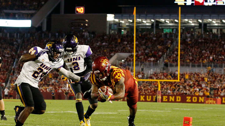 AMES, IA – SEPTEMBER 2: Running back David Montgomery #32 of the Iowa State Cyclones drives into the end zone for a touchdown as defensive back Nikholi Jaghai #24 of the Northern Iowa Panthers, and defensive back Malcolm Washington #2 of the Northern Iowa Panthers defend in the first half of play at Jack Trice Stadium on September 2, 2017 in Ames, Iowa. (Photo by David Purdy/Getty Images)