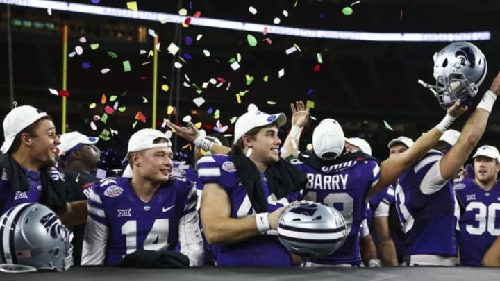 K-State football players celebrate after winning the Texas Bowl - Mandatory Credit: Troy Taormina-USA TODAY Sports
