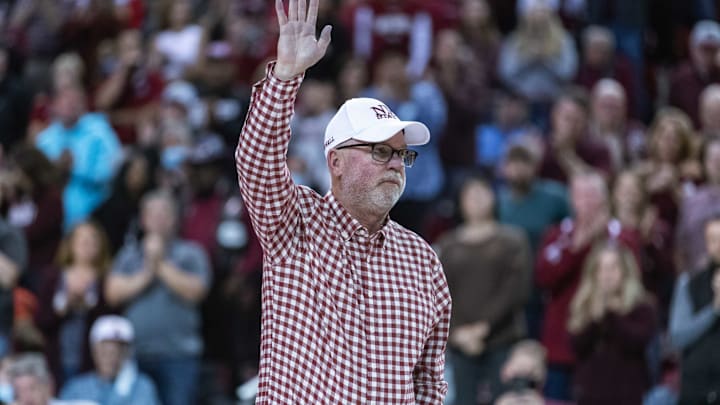 Jerry Kill accepts a NMSU football helmet as the New Mexico State Aggies face off against the University of New Mexico Lobos at the Pan American Center in Las Cruces on Tuesday, Nov. 30, 2021.Kill 2