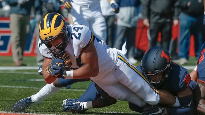 CHAMPAIGN, IL - OCTOBER 12: Zach Charbonnet #24 of the Michigan Wolverines dives into the end zone for a touchdown as Sydney Brown #30 of the Illinois Fighting Illini tries to make the stop during the first half at Memorial Stadium on October 12, 2019 in Champaign, Illinois. (Photo by Michael Hickey/Getty Images)