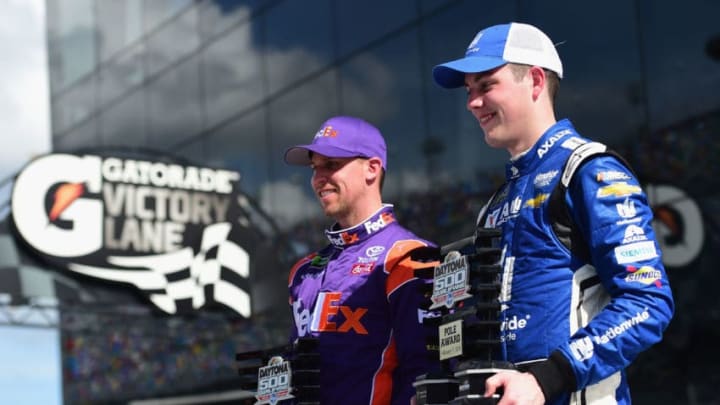 DAYTONA BEACH, FL - FEBRUARY 11: Denny Hamlin, driver of the #11 FedEx Express Toyota, and Alex Bowman, driver of the #88 Nationwide Chevrolet, pose for a photo after winning the pole award for the Monster Energy NASCAR Cup Series Daytona 500 at Daytona International Speedway on February 11, 2018 in Daytona Beach, Florida. (Photo by Jared C. Tilton/Getty Images)