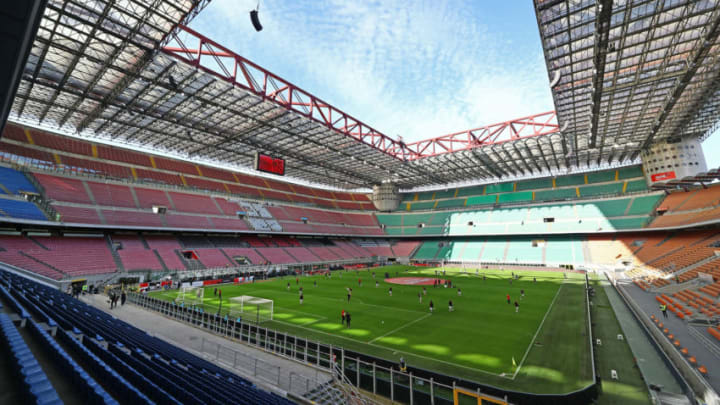 MILAN, ITALY - MARCH 08: AC Milan and Genoa CFC players warm up in the empty stadium after rules to limit the spread of Covid-19 have been put in place before the Serie A match between AC Milan and Genoa CFC at Stadio Giuseppe Meazza (also known as the San Siro stadium) on March 8, 2020 in Milan, Italy. (Photo by Marco Luzzani/Getty Images)