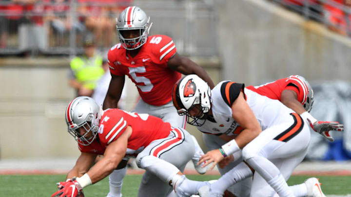 COLUMBUS, OH - SEPTEMBER 1: Nick Bosa #97 of the Ohio State Buckeyes recovers a fumble in the first quarter in front of Conor Blount #2 of the Oregon State Beavers at Ohio Stadium on September 1, 2018 in Columbus, Ohio. (Photo by Jamie Sabau/Getty Images)