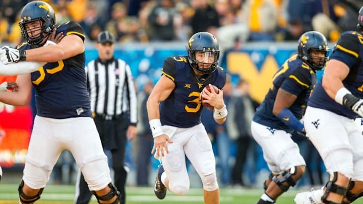 Oct 22, 2016; Morgantown, WV, USA; West Virginia Mountaineers quarterback Skyler Howard (3) runs the ball during the second quarter against the TCU Horned Frogs at Milan Puskar Stadium. Mandatory Credit: Ben Queen-USA TODAY Sports