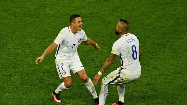 KAZAN, RUSSIA - JUNE 28: Alexis Sanchez of Chile celebrates scoring his side's third penalty with Arturo Vidal in the penalty shootout during the FIFA Confederations Cup Russia 2017 Semi-Final between Portugal and Chile at Kazan Arena on June 28, 2017 in Kazan, Russia. (Photo by Laurence Griffiths/Getty Images)