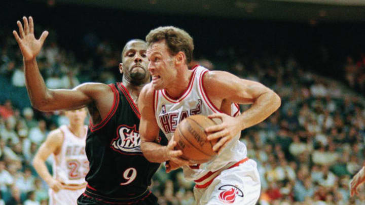 MIAMI, : Dan Majerle (R) of the Miami Heat drives to the basket past George Lynch of the Philadelphia 76ers (L) for two points during their game at the Miami Arena, 08 March. Majerle later scored the winning basket to give the Heat a 91-89 win. AFP PHOTO Roberto SCHMIDT (Photo credit should read ROBERTO SCHMIDT/AFP/Getty Images)