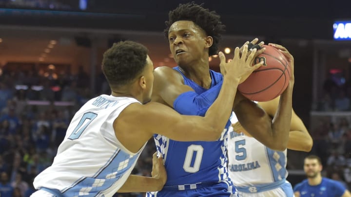 Mar 26, 2017; Memphis, TN, USA; Kentucky Wildcats guard De’Aaron Fox (0) drives to the basket against North Carolina Tar Heels guard Nate Britt (0) in the second half during the finals of the South Regional of the 2017 NCAA Tournament at FedExForum. Mandatory Credit: Justin Ford-USA TODAY Sports