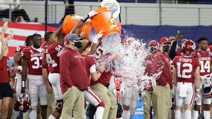 Dec 30, 2020; Arlington, TX, USA; Oklahoma Sooners head coach Lincoln Riley is doused with water during a game against the Florida Gators at ATT Stadium. Mandatory Credit: Tim Heitman-USA TODAY Sports