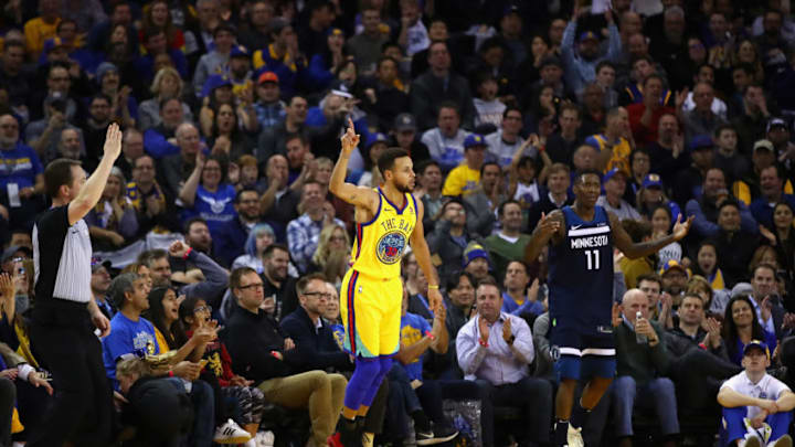 OAKLAND, CA - JANUARY 25: Stephen Curry #30 of the Golden State Warriors reacts after making a three-point basket over Jamal Crawford #11 of the Minnesota Timberwolves at ORACLE Arena on January 25, 2018 in Oakland, California. NOTE TO USER: User expressly acknowledges and agrees that, by downloading and or using this photograph, User is consenting to the terms and conditions of the Getty Images License Agreement. (Photo by Ezra Shaw/Getty Images)