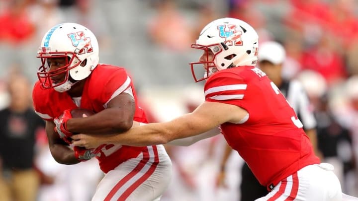 Sep 10, 2016; Houston Cougars quarterback Kyle Postma (3) hands off the ball to Houston Cougars running back Kevrin Justice (32) against the Lamar Cardinals during the first quarter at TDECU Stadium. Mandatory Credit: Erik Williams-USA TODAY Sports