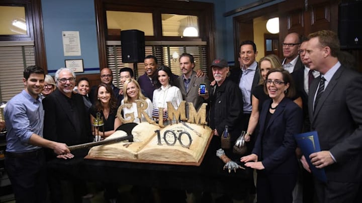 PORTLAND, OR – NOVEMBER 10: (R) NBC Entertainment chairman Robert Greenblatt and Oregon governor Kate Brown, pose with the cast of the TV series ‘Grimm’ next to the cake celebrating the 100th episode of the series on November 10, 2015 in Portland, Oregon. (Photo by Steve Dykes/Getty Images)