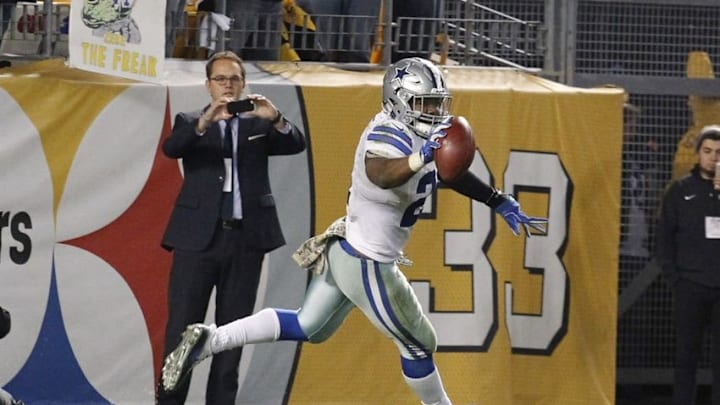 Nov 13, 2016; Pittsburgh, PA, USA; Dallas Cowboys running back Ezekiel Elliott (21) celebrates his thirty-two yard touchdown to win the game against the Pittsburgh Steelers during the fourth quarter at Heinz Field. Dallas won 35-30. Mandatory Credit: Charles LeClaire-USA TODAY Sports