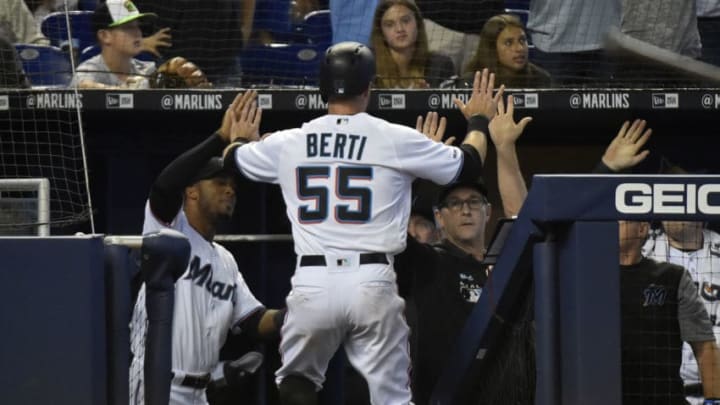 MIAMI, FL - MAY 05: Jon Berti #55 of the Miami Marlins is congratulated by teammates after scoring in the eighth inning against the Atlanta Braves at Marlins Park on May 5, 2019 in Miami, Florida. (Photo by Eric Espada/Getty Images)