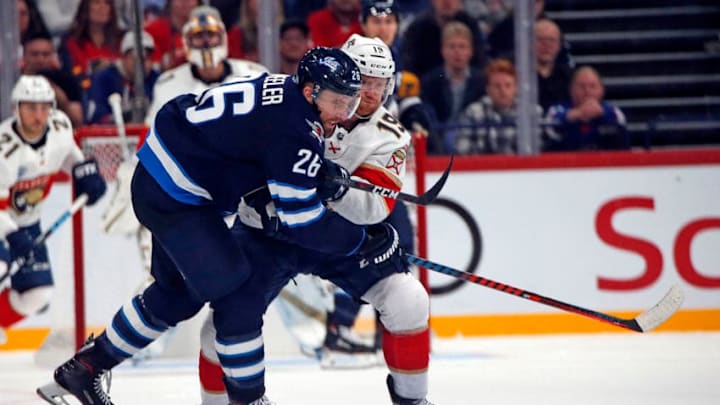 HELSINKI, FINLAND - NOVEMBER 2: Michael Matheson #19 of the Florida Panthers tangles with Blake Wheeler #26 of the Winnipeg Jets in the 2018 NHL Global Series at the Hartwall Arena on November 2, 2018 in Helsinki, Finland. (Photo by Eliot J. Schechter/NHLI via Getty Images)
