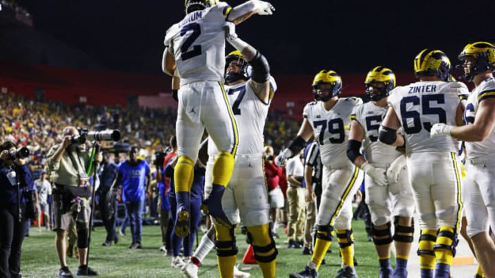 PISCATAWAY, NJ - NOVEMBER 05: Trevor Keegan #77 lifts Blake Corum #2 of the Michigan Wolverines during the a game against the Rutgers Scarlet Knights at SHI Stadium on November 5, 2022 in Piscataway, New Jersey. Michigan defeated Rutgers 52-17. (Photo by Rich Schultz/Getty Images)