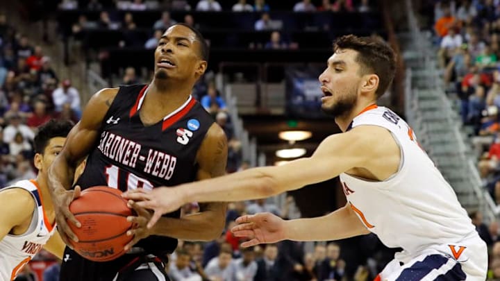 COLUMBIA, SOUTH CAROLINA - MARCH 22: Nate Johnson #10 of the Gardner Webb Runnin Bulldogs handles the ball against Ty Jerome #11 of the Virginia Cavaliers in the first half during the first round of the 2019 NCAA Men's Basketball Tournament at Colonial Life Arena on March 22, 2019 in Columbia, South Carolina. (Photo by Kevin C. Cox/Getty Images)