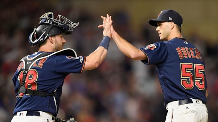 MINNEAPOLIS, MN - JUNE 15: Mitch Garver #18 and Taylor Rogers #55 of the Minnesota Twins celebrate defeating the Kansas City Royals after the game on June 15, 2019 at Target Field in Minneapolis, Minnesota. The Twins defeated the Royals 5-4. (Photo by Hannah Foslien/Getty Images)
