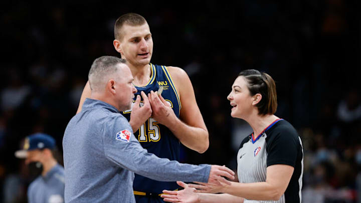 Denver Nuggets head coach Michael Malone argues a call with referee Lauren Holtkamp-Sterling (7) as center Nikola Jokic (15) gestures in the second quarter against the Houston Rockets at Ball Arena on 6 Nov. 2021. (Isaiah J. Downing-USA TODAY Sports)