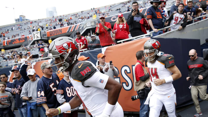 CHICAGO, IL – SEPTEMBER 30: Quarterbacks Jameis Winston #3 and Ryan Fitzpatrick #14 of the Tampa Bay Buccaneers run out to the field prior to the game against the Chicago Bears at Soldier Field on September 30, 2018 in Chicago, Illinois. (Photo by Joe Robbins/Getty Images)