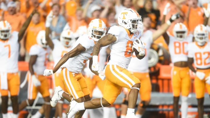 Tennessee running back Tiyon Evans (8) runs for a touchdown during the first quarter of an NCAA football game against Florida at Ben Hill Griffin Stadium in Gainesville, Florida on Saturday, Sept. 25, 2021.Tennflorida0925 1072