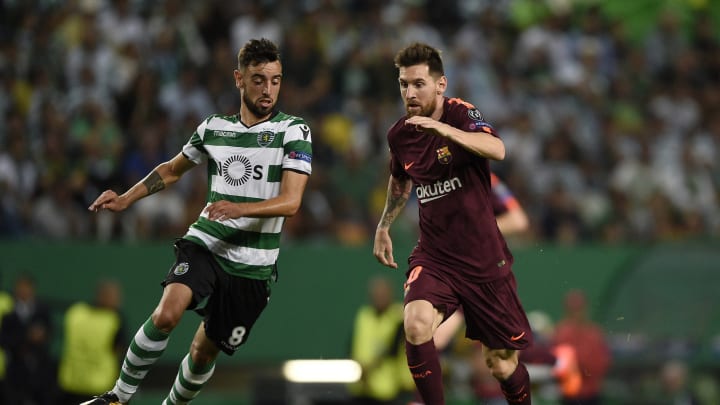LISBON, PORTUGAL – SEPTEMBER 27: Bruno Fernandes of Sporting CP competes for the ball with Lionel Messi of FC Barcelona during the UEFA Champions League group D match between Sporting CP and FC Barcelona at Estadio Jose Alvalade on September 27, 2017 in Lisbon, Portugal. (Photo by Octavio Passos/Getty Images)
