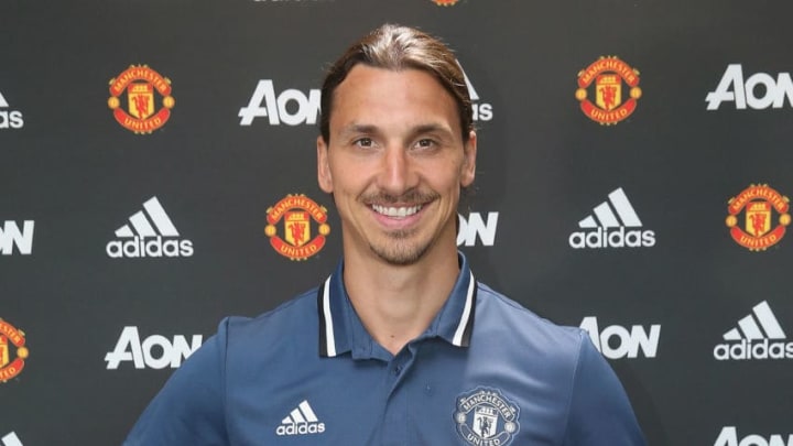 MANCHESTER, ENGLAND - JULY 01: (MINIMUM FEES APPLY - MINIMUM PRINT/BROADCAST FEE OF 150 GBP, ONLINE FEE OF 75 GBP, OR LOCAL EQUIVALENT) (EXCLUSIVE COVERAGE) Zlatan Ibrahimovic of Manchester United poses after signing for the club at Aon Training Complex on July 1, 2016 in Manchester, England. (Photo by John Peters/Man Utd via Getty Images)