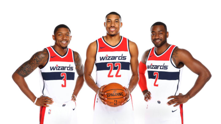 WASHINGTON, DC - SEPTEMBER 25: Bradley Beal #3 Otto Porter Jr. #22 and John Wall #2 of the Washington Wizards pose for a portrait during Media Day on September 25, 2017 at Capital One Center in Washington DC. NOTE TO USER: User expressly acknowledges and agrees that, by downloading and or using this photograph, User is consenting to the terms and conditions of the Getty Images License Agreement. Mandatory Copyright Notice: Copyright 2017 NBAE (Photo by Ned Dishman/NBAE via Getty Images)