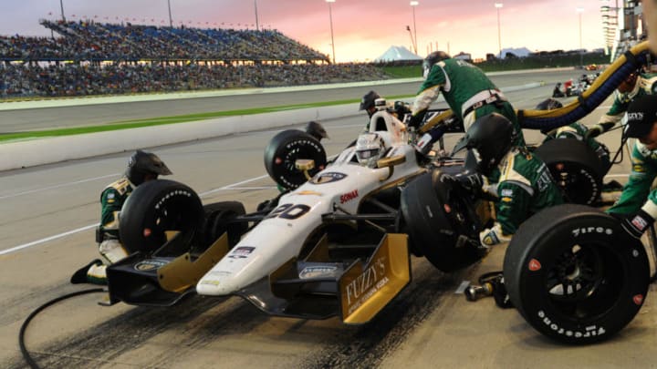 NEWTON, IA - JULY 12: Ed Carpenter driver of the #20 Ed Carpenter Racing Dallara Chevrolet makes a pit stop during the Verizon IndyCar Series Iowa Corn Indy 300 presented by DEKALB at the Iowa Speedway on July 12, 2014 in Newton, Iowa. (Photo by Robert Laberge/Getty Images)