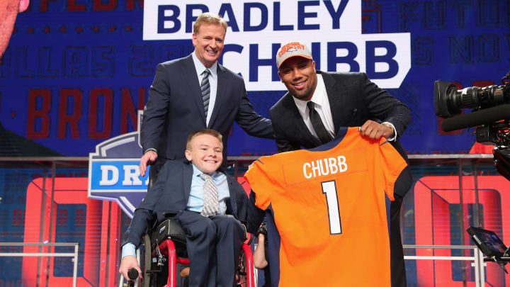 ARLINGTON, TX – APRIL 26: Austin Denton, a 17-year-old cancer survivor, poses with Bradley Chubb of NC State after he was selected