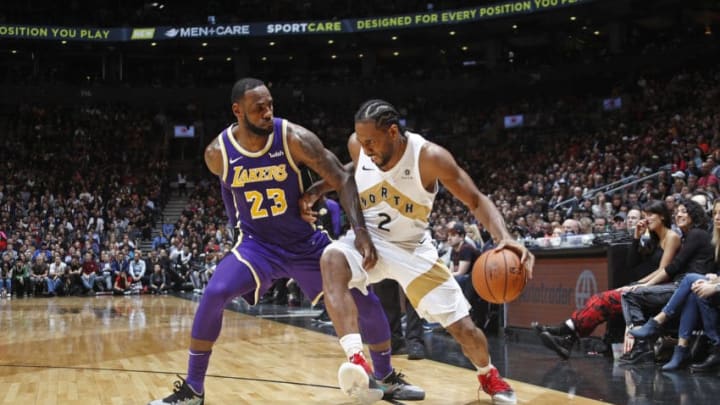 TORONTO, CANADA - MARCH 14: Kawhi Leonard #2 of the Toronto Raptors handles the ball against LeBron James #23 of the Los Angeles Lakers on March 14, 2019 at the Scotiabank Arena in Toronto, Ontario, Canada. NOTE TO USER: User expressly acknowledges and agrees that, by downloading and or using this Photograph, user is consenting to the terms and conditions of the Getty Images License Agreement. Mandatory Copyright Notice: Copyright 2019 NBAE (Photo by Mark Blinch/NBAE via Getty Images)