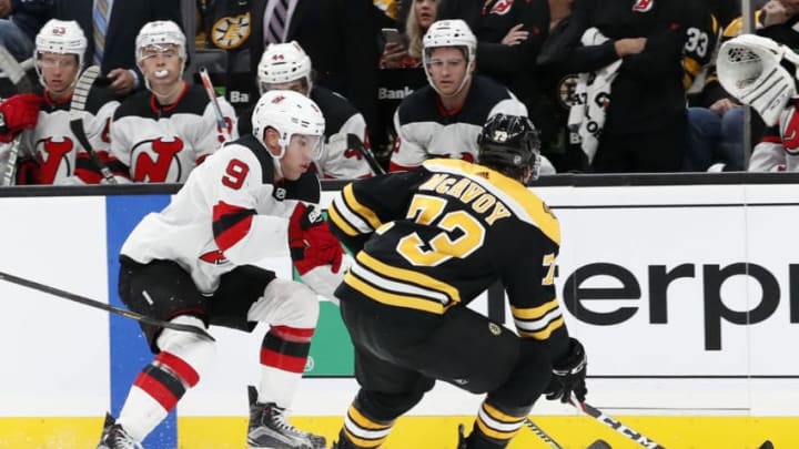 BOSTON, MA - OCTOBER 12: New Jersey Devils left wing Taylor Hall (9) tries to get past Boston Bruins right defenseman Charlie McAvoy (73) during a game between the Boston Bruins and the New Jersey Devils on October 12, 2019, at TD Garden in Boston, Massachusetts. (Photo by Fred Kfoury III/Icon Sportswire via Getty Images)