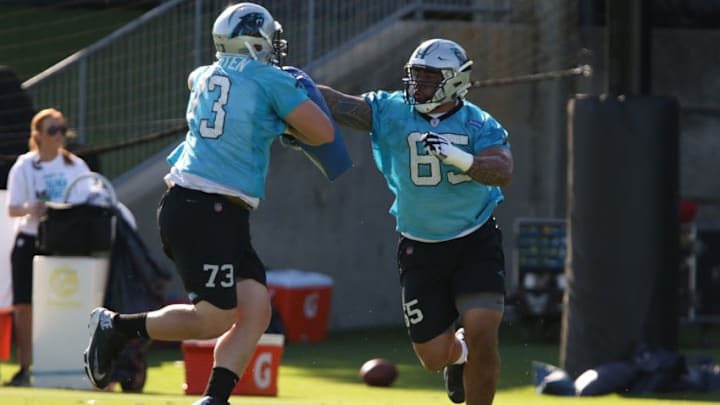 CHARLOTTE, NC - JUNE 04: Greg Van Roten (73) and Amini Silatolu (65) work through a drill during the Carolina Panthers OTA (Organized Training Activities) at the Carolina Panthers Training Facility on June 04, 2018 in Charlotte, NC. (Photo by John Byrum/Icon Sportswire via Getty Images)