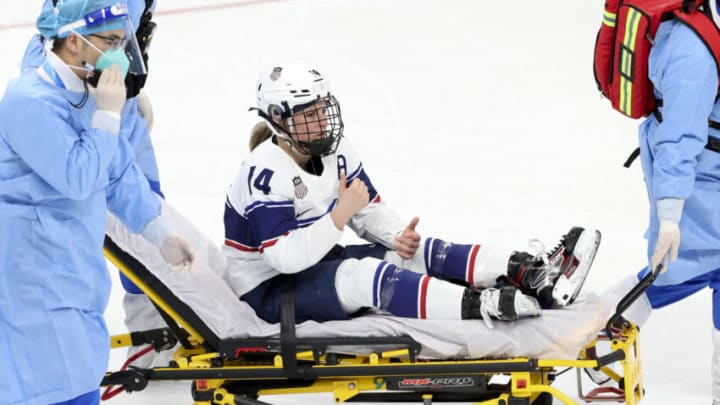 BEIJING, CHINA - FEBRUARY 03: Brianna Decker #14 of Team United States goes off injured and has to leave the ice on a stretcher during the Women's Ice Hockey Preliminary Round Group A match between Team United States and Team Finland at Wukesong Sports Centre on February 03, 2022 in Beijing, China. (Photo by Jean Catuffe/Getty Images)